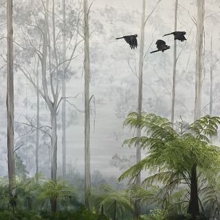 Three black cockatoos fly through a misty Australian bush setting with tree ferns and gum trees.