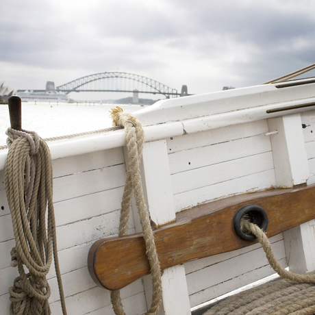 Photograph taken from an old boat on Sydney Harbour. The Harbour Bridge can be seen in the distance 