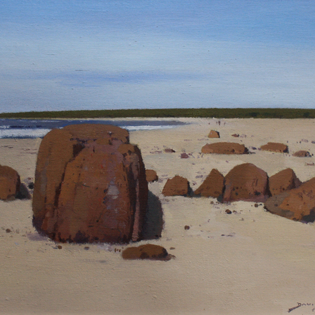 Rocks and sand and a view south along Dolphin Beach, Moruya.