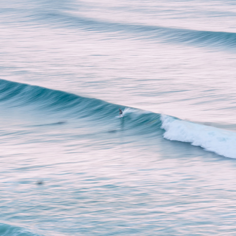 surfer sunrise wave swell ocean beach