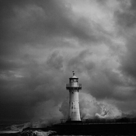 
Fortunate to be at Belmore Basin Wollongong on a moody/rather rugged day when waves were big and crashing around the lighthouse . Black & white creates an accurate record of the environment that day.