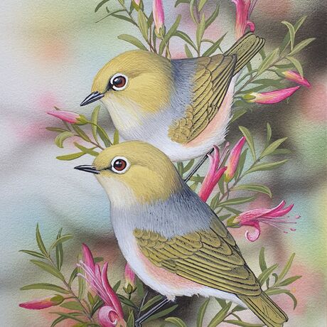 two small birds on a flowering shrub