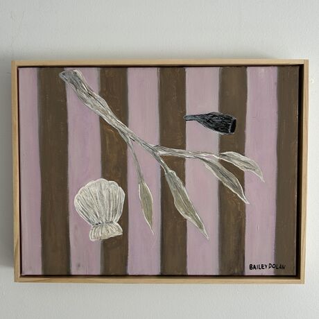 A collection of a shell and small branch with a striped background 