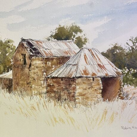 Old stone ruins on dry grassy land