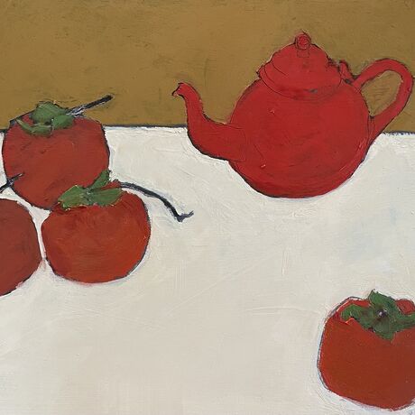 Red persimmon and teapot on  white table