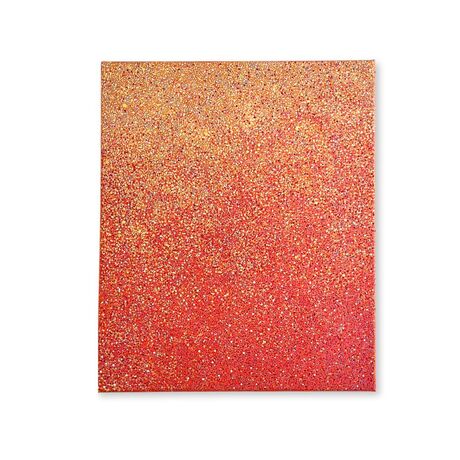 A red, orange, and yellow abstract dotted painting.