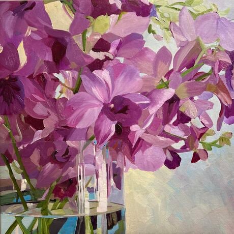 Purple Singapore Orchids in glass vase with reflections