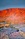 Saltbush outback in front of red ranges