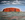 Uluru/Ayers Rock under approaching storm in outback Australia.