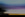 An abstract look at nature, this is an image of a sunrise with a blurred trees on the left and bottom of the frame. Taken with camera movement and edited with extra texture this image looks like a painting.