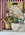 This painting depicts a stone kitchen benchtop with a pottery teapot with a bamboo handle, several timber and marble chopping boards, a lit candle and a small pot with basil growing. The background is of a dark red and white striped wallpaper.