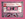 An old school cassette mix tape labeled Freedom Mix on a bright pink background.