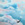 woman flying unaided in pink & blue clouds; a sense of welbeing