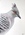 A crested pigeon looking sideways at the viewer 