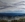 View of Marysville from Lake Mountain, mountains fading into the distance,  dramatic overcast sky.