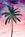 Coconut palm tree in front of peachy purple wispy sunset sky