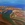 An aerial view of Port Hedland, with red soil and blue-green water.