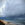 dramatic storm clouds approach a beach