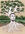 A young man growing as a white and green ghost gum tree in the Australian bush.