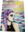 Woman with braided  purple hair and bright sun behind her depicting colours of grey, yellow, purple and blue