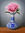 Pink rose in blue and white vase