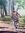 Two women return home to their village, carrying the firewood they collected during the day from nearby bush land. Here they carry a single big piece of log, expertly balancing it on their heads.