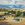 Rural Australian Landscape depicting a pond in the foreground,  rolling hills in the background.