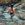 Back view of a woman standing waist deep in an ocean Rockpool 