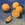 This is a  carefully arranged group of oranges on a blue surface and background. 