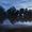 Water flowing gently by in a river at dusk.
Framed.
