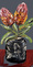 Two menziesii banksias painted in a modern clay vase with a dark grey background. 