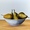 Bowl of golden pears in a white bowl with a clean white background still life