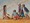 Family of children, brothers and sister, digging in the sand at the beach