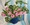 Pink tulips and a swiss cheese indoor plant in patterned pots sit on a blue and white stripe cloth.