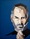 A portrait of Steve Jobs on a blue background