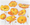 Painting of yellow poppies on a white painted background.