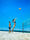 A couple of friends playing beach volleyball on the surfers paradise broad beach Gold Coast.