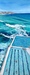 people swimming at colourful Bondi icebergs pool with ocean and beach in the background 