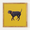 Angry black dog on a yellow background