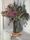 Still life with native flowers in glass vase- banksia, eucalyptus & Boronia