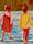 An artwork showing two girls walking along in the shallow water.