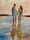 artwork image of a couple walking contendly along the beach at dusk