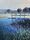 A wharf over a pond of reflective calm water with wheat in foreground blowing in the breeze.
