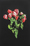 Image is a painted stencil artwork of a rose bouquet. The flowers are painted in hues of red to pink, with green foliage on a black background.