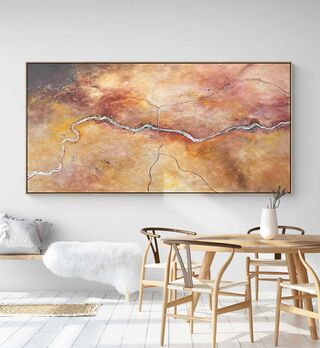 Rich and earthy tones of the Australian outback with a road meandering through the centre.
