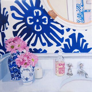 white bathroom with deep blue wallpaper and soft pink flowers and handwash