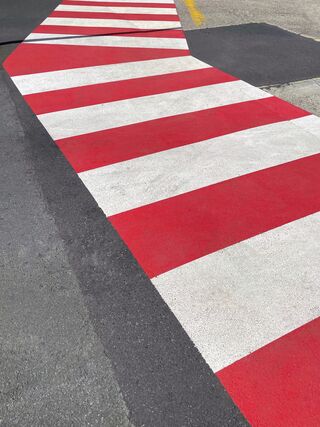 A path in red and white stripes in an urban minimalism  capture 