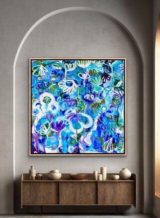 Large and small swirling shapes depicting flowers and trees in shades of blues and purples with white 