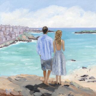 A young couple looking out to sea. He with dark hair, wearing  a blue linen shirt. She with light brown hair and a patterned white dress.