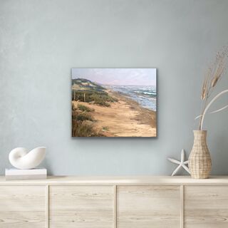 Beautiful beach scene with people walking their dogs watching the crashing waves